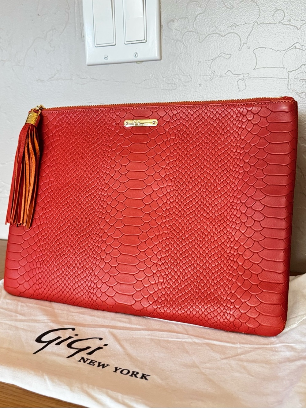 Gigi New York reptile orange leather Uber clutch